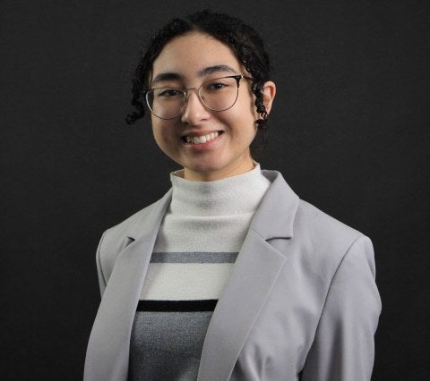 woman with glasses in business attire